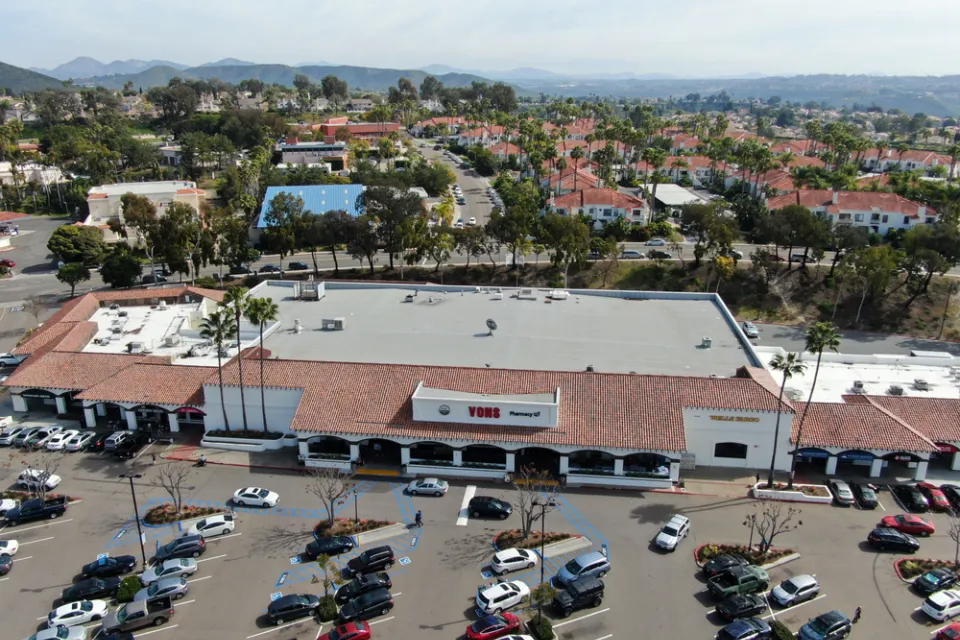 Aerial view of large store with parking and houses with beach in background in Rancho Penasquitos, California